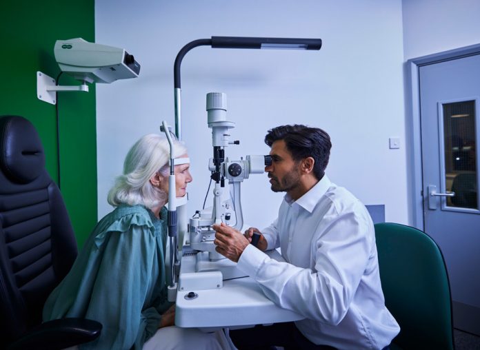 optometrist doing eye test